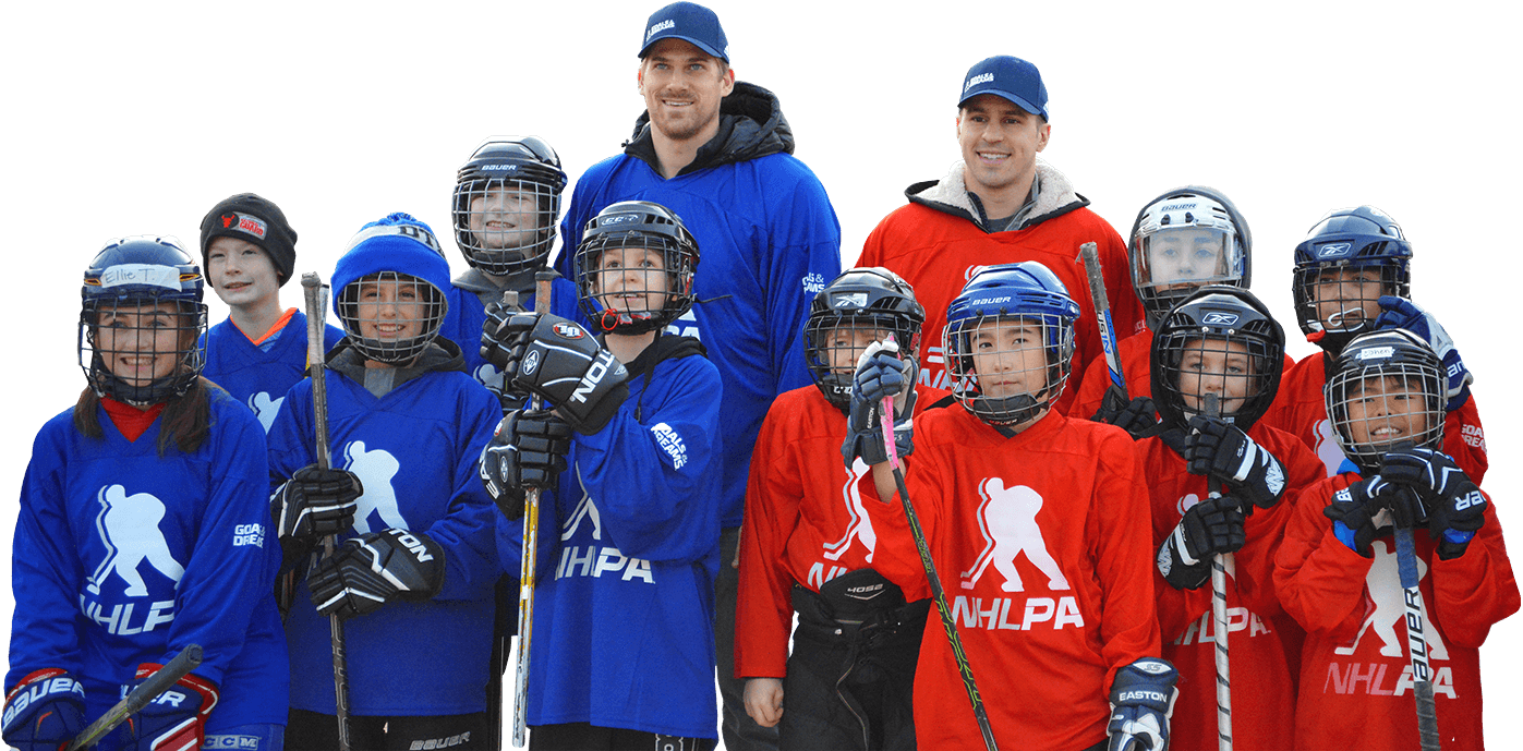 Group photo of youth hockey players with Zach Parise and Marcus Foligno